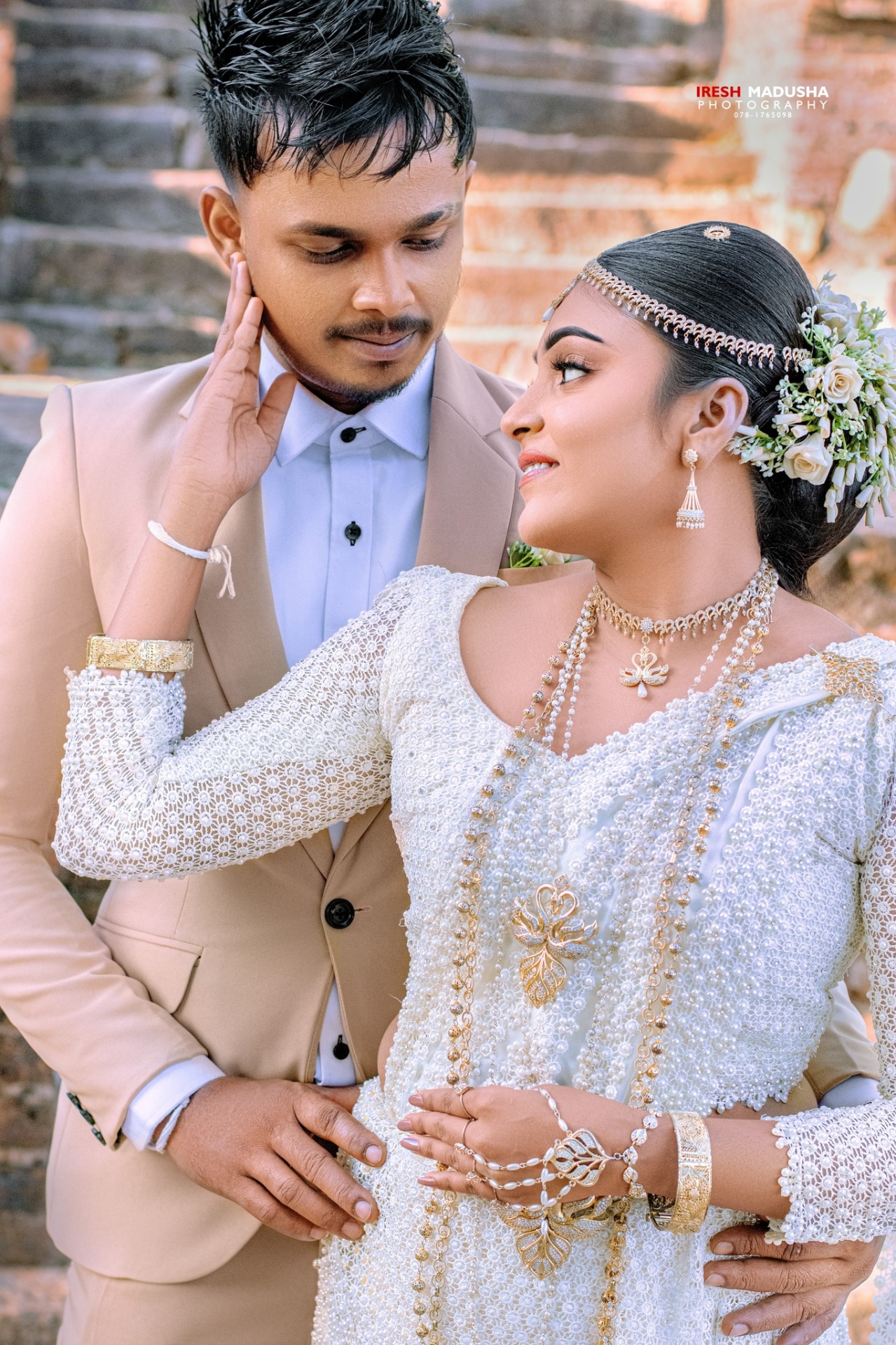 Intimate bridal couple portrait by Iresh Madhusha